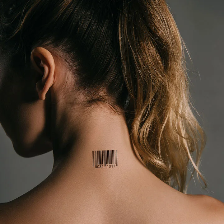 portrait of the back of a lovely brunette woman with a bar code tattoo on the nape of her neck