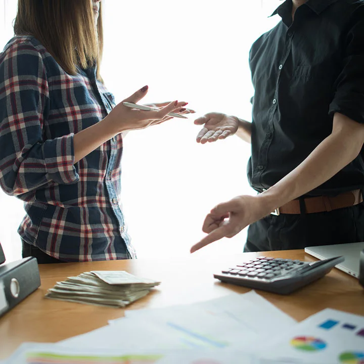 man and woman arguing over money