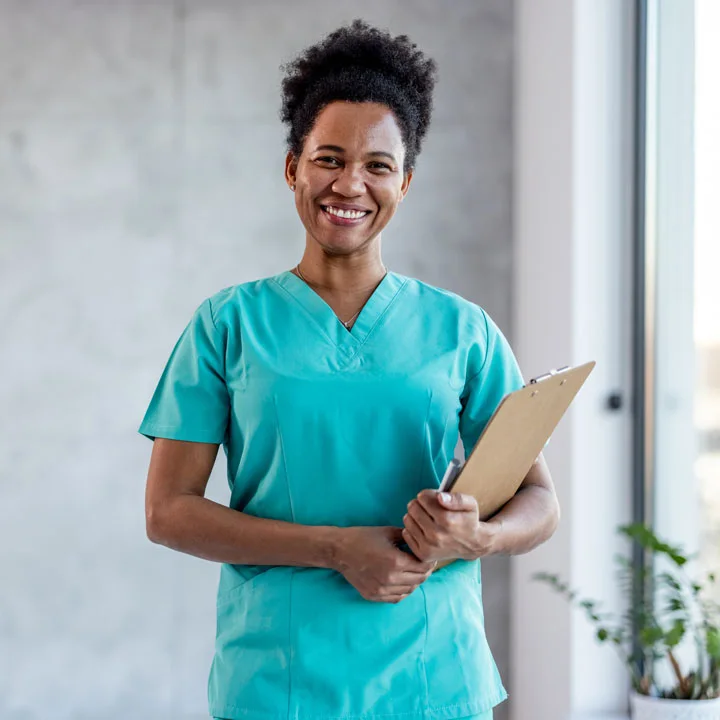 an African American female Sexual Assault Nurse Examiner forensic nurse in teal scrubs