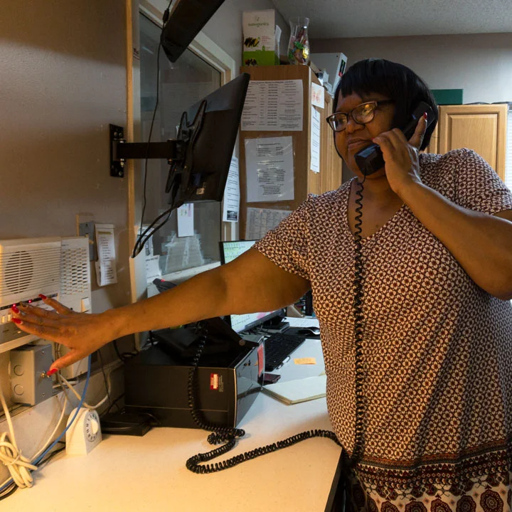 GCCFN resident assistant working the phone lines