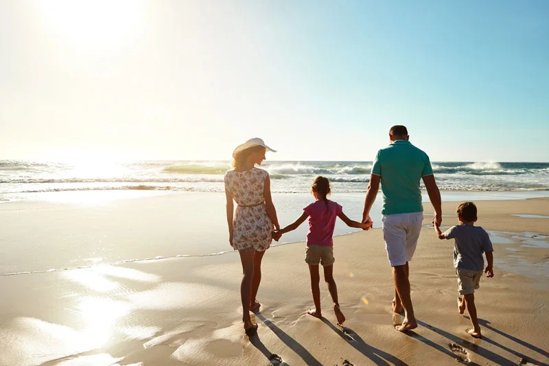 Shot of a family enjoying some quality time together at the beach