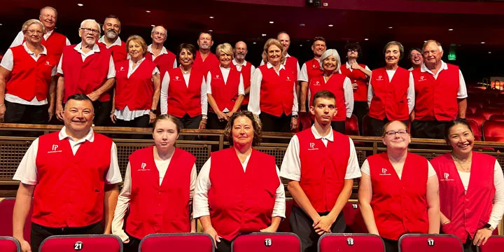 group photo of our IP concert usher volunteers in their red vests